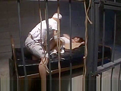 Nozomi Mitani is fucked with dildo and doggy behind the bars