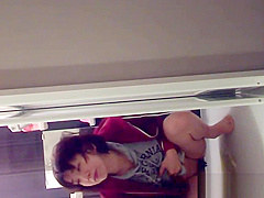 Asian fills glass of piss