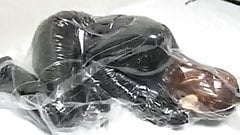 Girl with Rubber Mask in Vacuum Bag