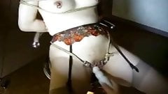 Pierced slave with rings in her pussy fucked with toy