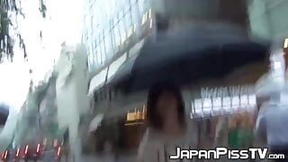 Young Japanese takes her panties off to pee in a coffee shop